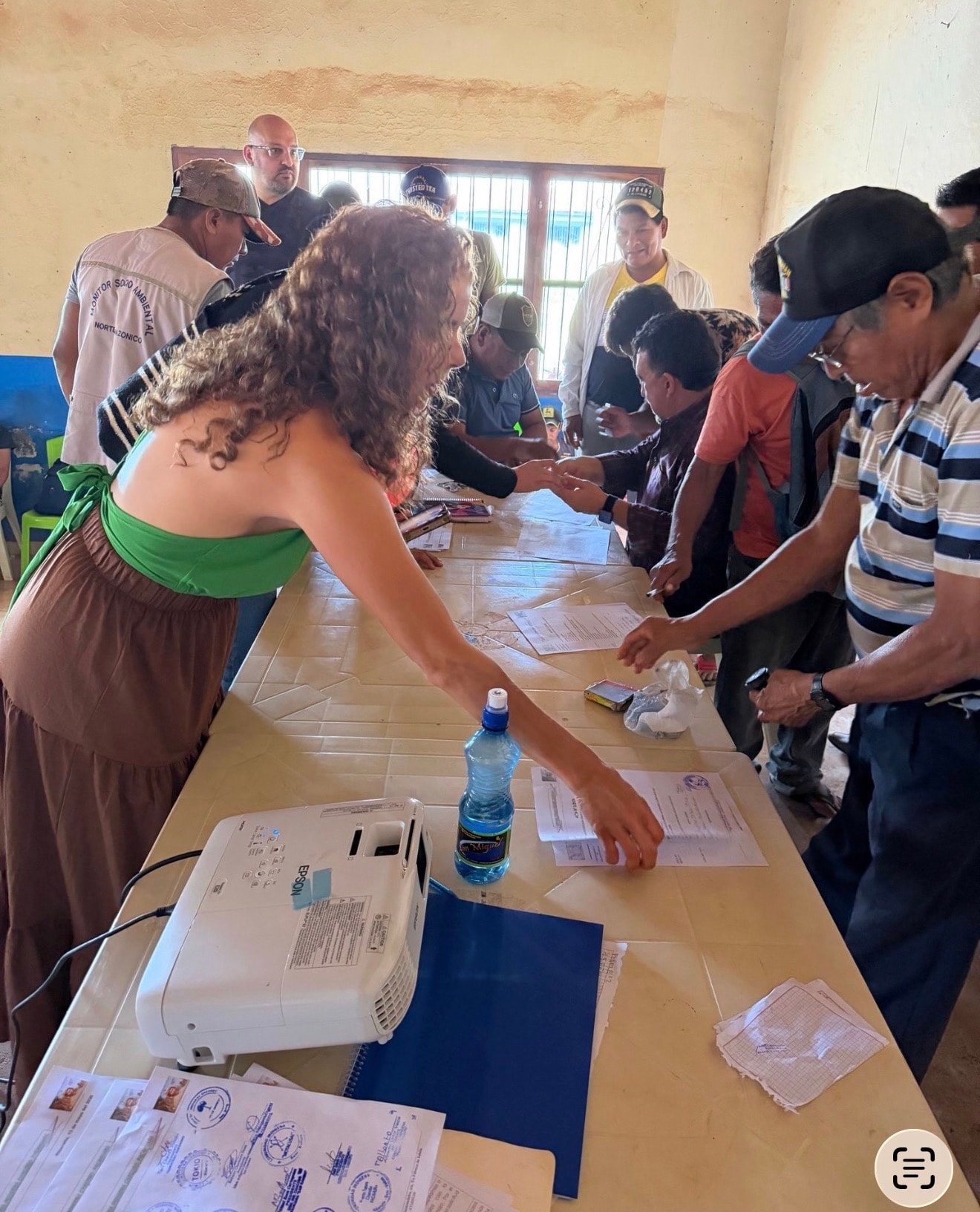 Community members and ORO team signing territorial participation documents
