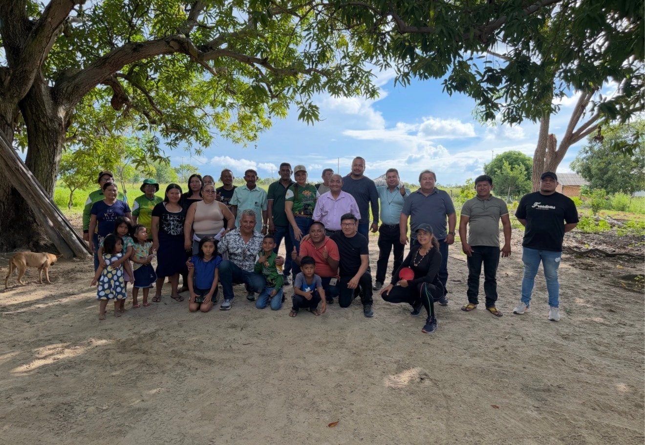 ORO community partners — a full community group gathered under trees after a territorial assembly